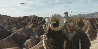 A Tuscan Raider atop a bantha watching what appears to be the Razor Crest in The Mandalorian Season 2 trailer