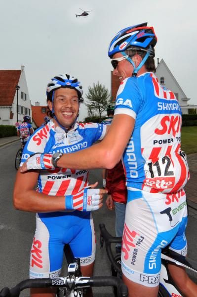 Stage winner Kenny Van Hummel, left, is congratulated by teammate Dominique Cornu.