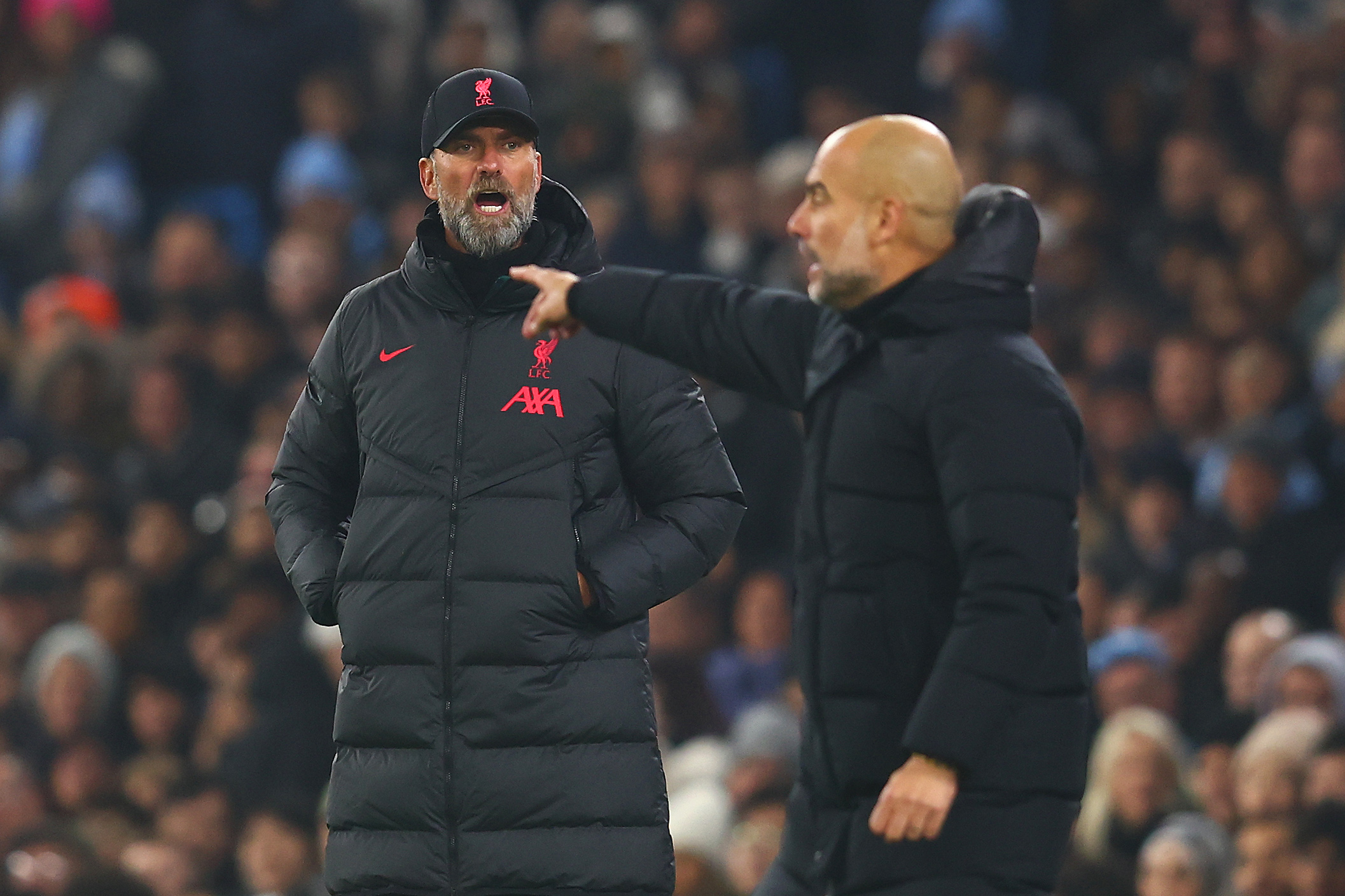 MANCHESTER, ENGLAND - DECEMBER 22:  Liverpool Manager Jurgen Klopp reacts to Manchester City Manager Pep Guardiola during the Carabao Cup Fourth Round match between Manchester City and Liverpool at Etihad Stadium on December 22, 2022 in Manchester, England. (Photo by Chris Brunskill/Fantasista/Getty Images)