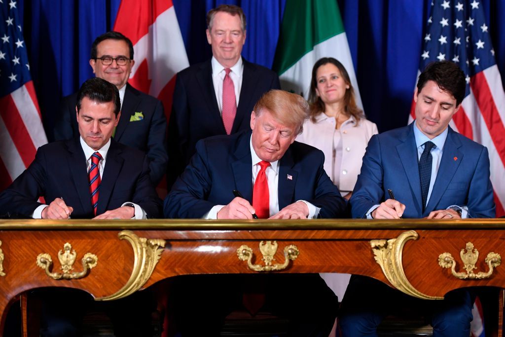 Mexico&amp;#039;s President Enrique Pena Nieto (L) US President Donald Trump (C) and Canadian Prime Minister Justin Trudeau, sign a new free trade agreement in Buenos Aires, on November 30, 2018