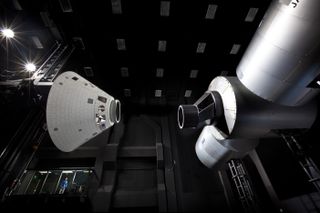 Lockheed Martin’s Space Operations Simulation Center in Colorado can simulate on-orbit docking maneuvers, using mockups of NASA's Orion space capsule (left) and the International Space Station.