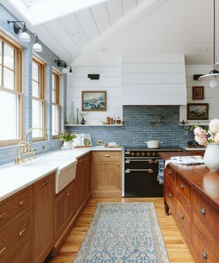 Blue and wooden kitchen designed by Emily Henderson