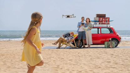 best beginner drone: family flying a DJI mini 2 drone on a beach
