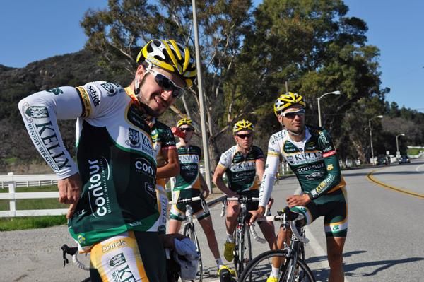 Zach Bell (left) and teammates stop to shed some excess clothing approaching Westlake Village.
