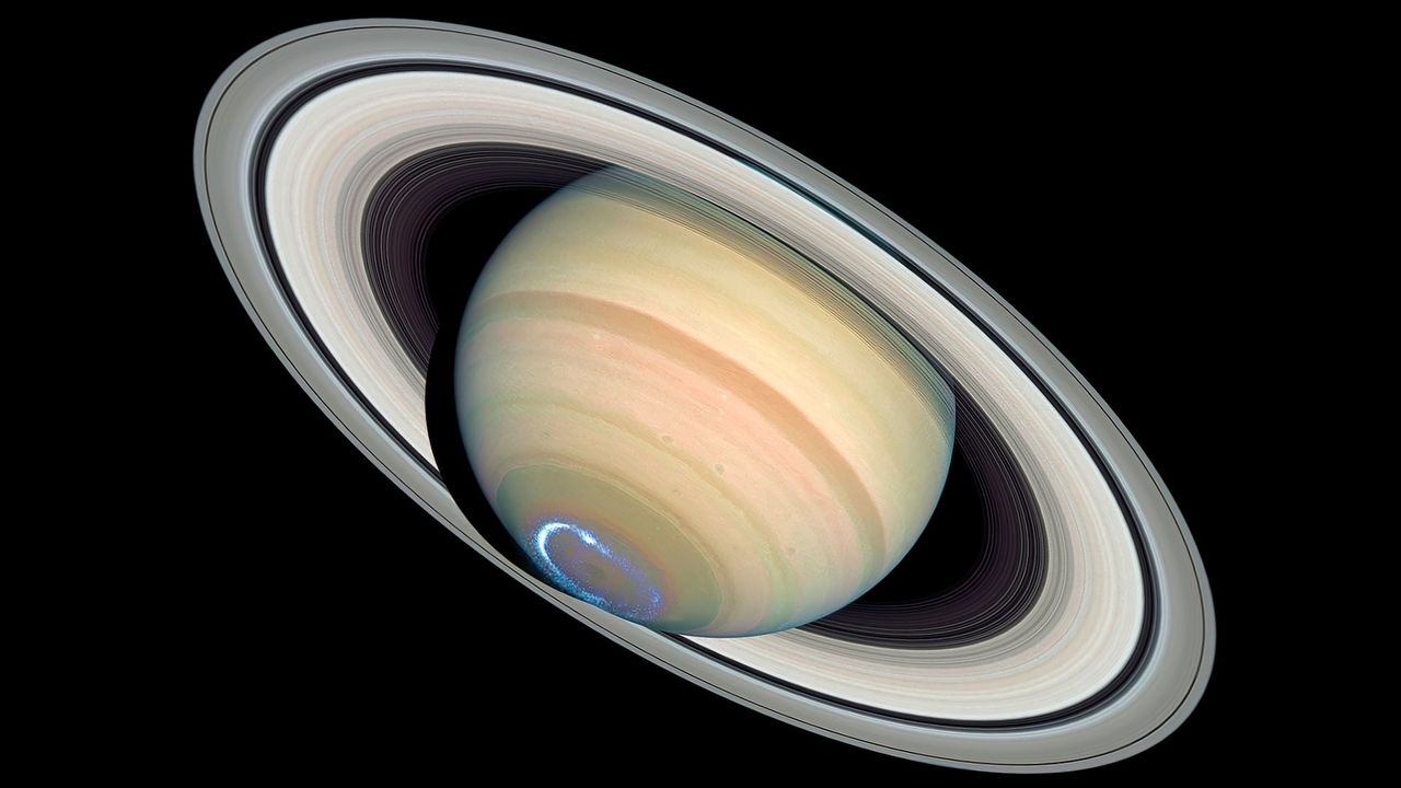 An image of Saturn showing auroras on its southern pole