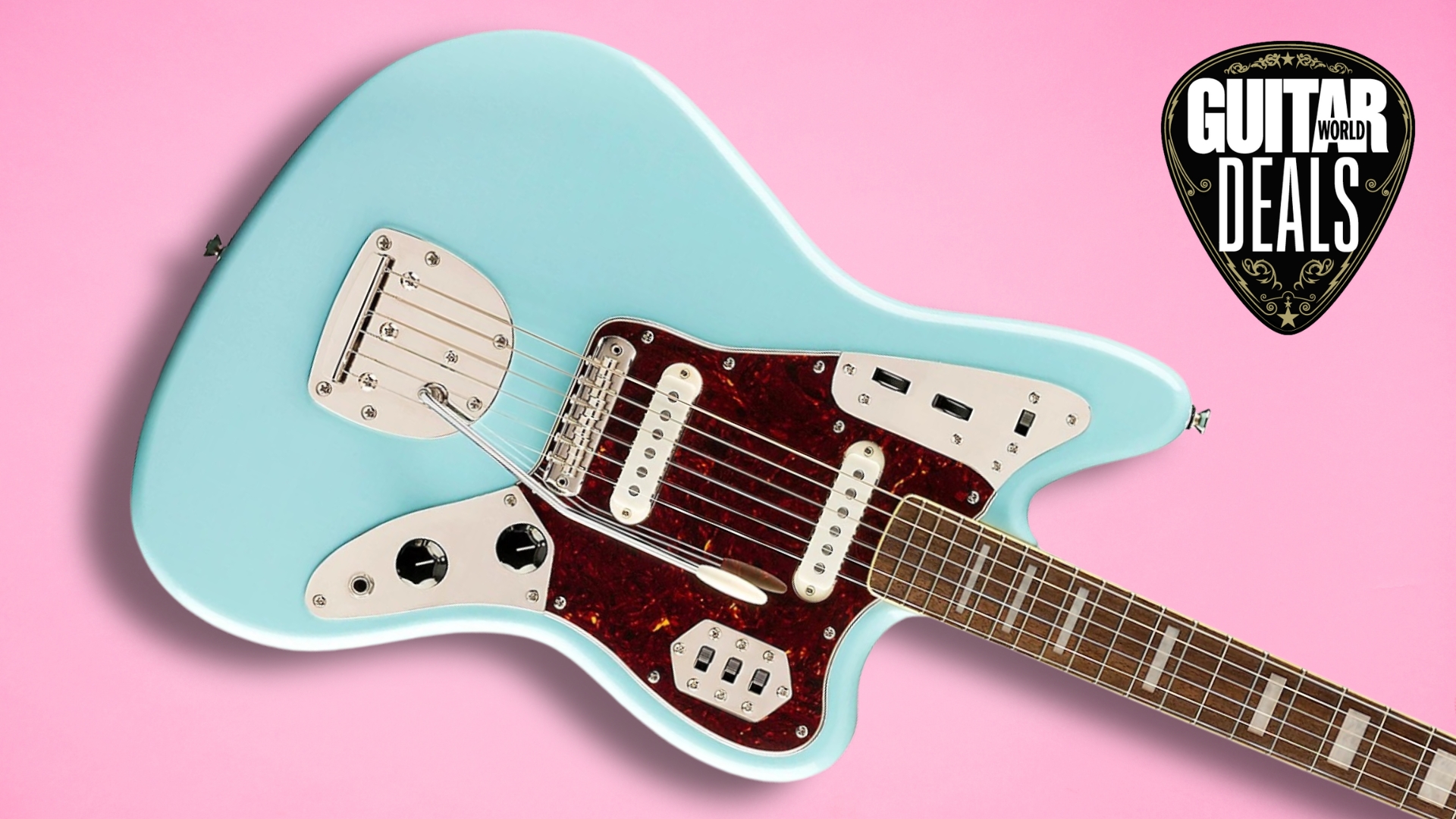 A Squier Jaguar electric guitar on a pink background