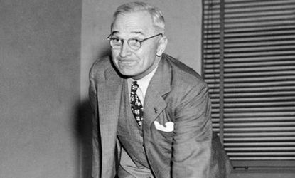 President Harry S. Truman rolls one down the alley at the White House bowling alley in 1947.