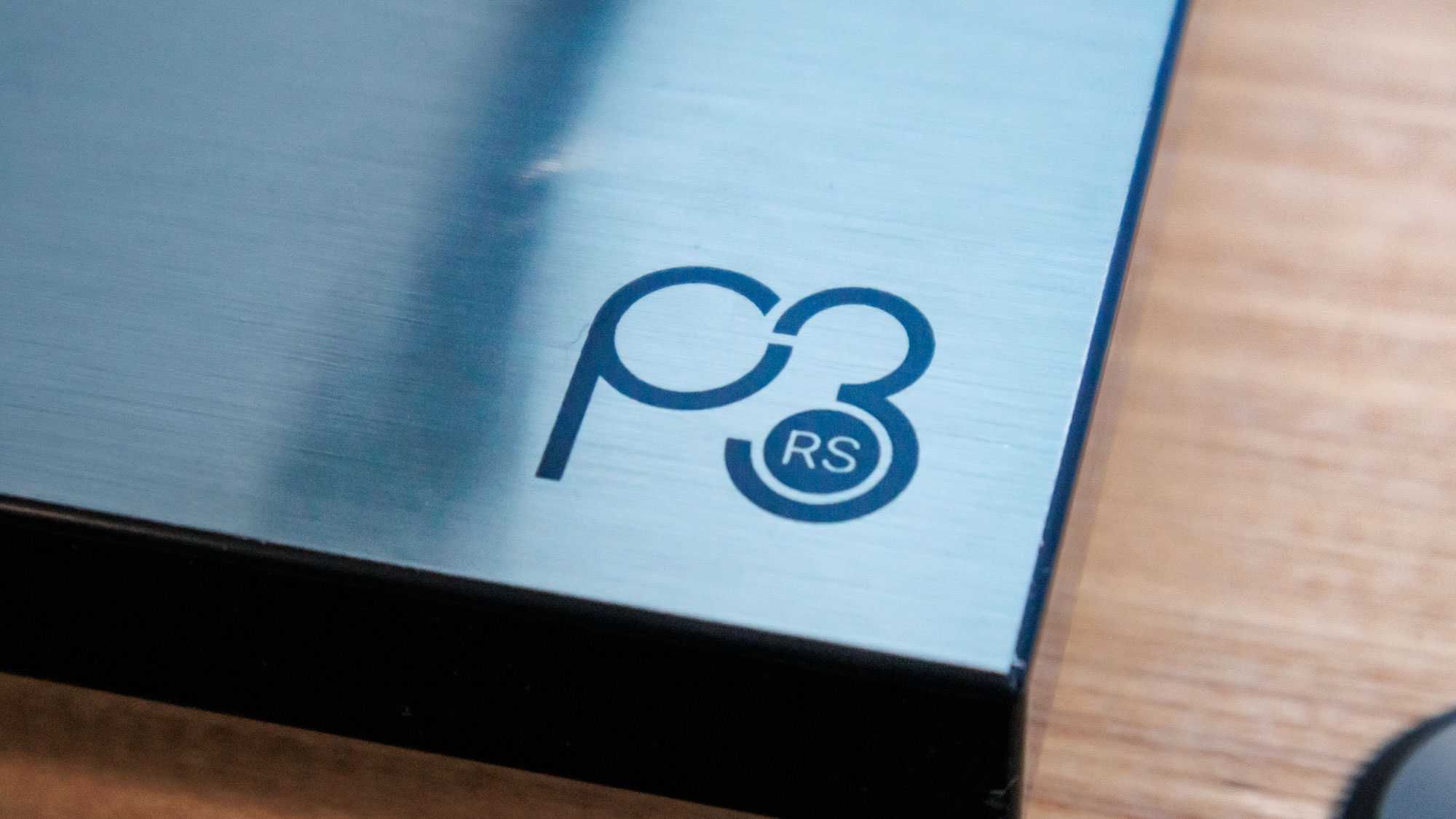 The Rega Planar 3 RS on an entertainment stand.