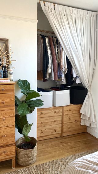 Bedroom with DIY closet with curtain as door