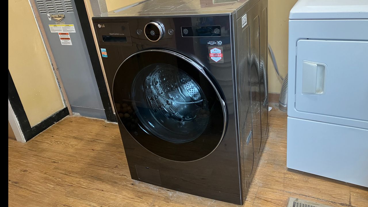 LG 5.0 cu. ft. Mega Capacity Smart Front Load All-in-One Washer Dryer Combo close up on reveiw
