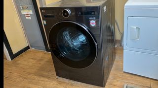 LG 5.0 cu. ft. Mega Capacity Smart Front Load All-in-One Washer Dryer Combo close up on review