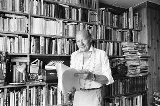 Roy Plomley devised and presented Desert Island Discs from when it was first broadcast on the 29th January 1942 until his death in 1985. He is seen here in the study of his Putney home overlooking the River Thames on 30th July 1984.