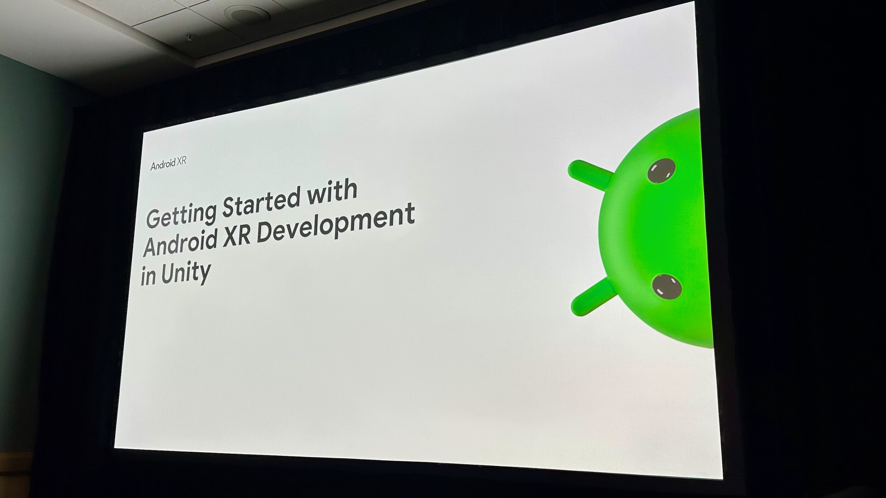 A screen at AWE 2025 showing "Getting Started with Android XR Development in Unity" and an Android logo.
