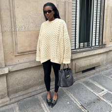 Marilyn wearing a cream jumper with leggings and pointed shoes.