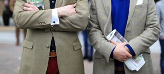 Cheltenham Festival racegoers dressed in Tweed (PA)