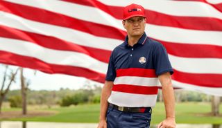 Zach Johnson stands in front of an American flag