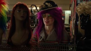 Kate McKinnon with a silly purple wig in Ghostbusters