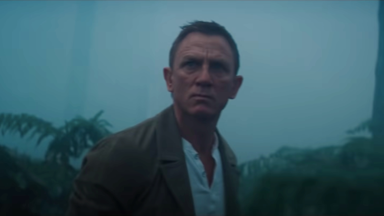 Daniel Craig looking mad in the woods in No Time To Die.