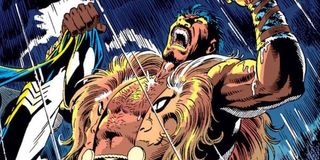 Kraven the Hunter yelling and holding Spider-Man costume