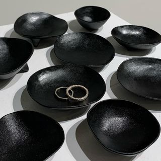 Ishikawa craft: black bowls on white background