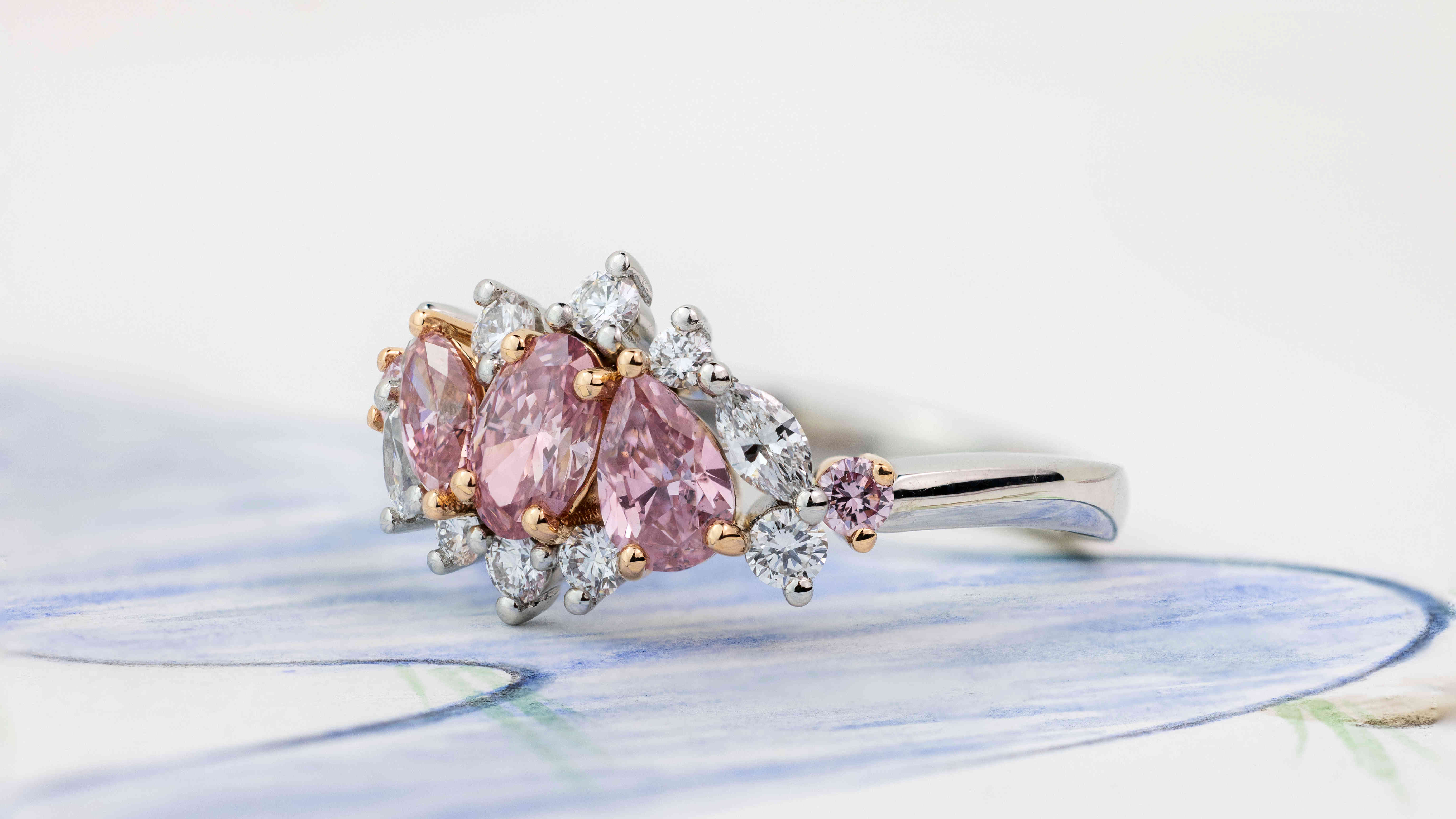Asymmetrical white and pink diamond ring
