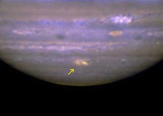 A variety of images depicts the spot on Jupiter likely caused by a comet or asteroid, July 2009, similar to the impacts of Comet Shoemaker-Levy's fragments on Jupiter in 1994. This image shows the impact site as a yellow spot at center bottom, and was tak