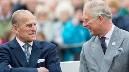 Prince Philip, Duke of Edinburgh and Prince Charles, Prince of Wales attend the unveiling of a statue of Queen Elizabeth The Queen Mother