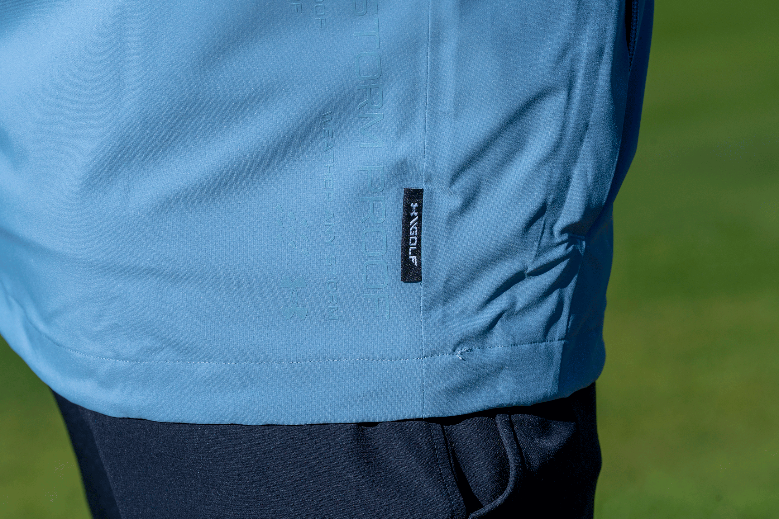 A close-up of the Under Armour Drive Pro Rain Jacket in 2026