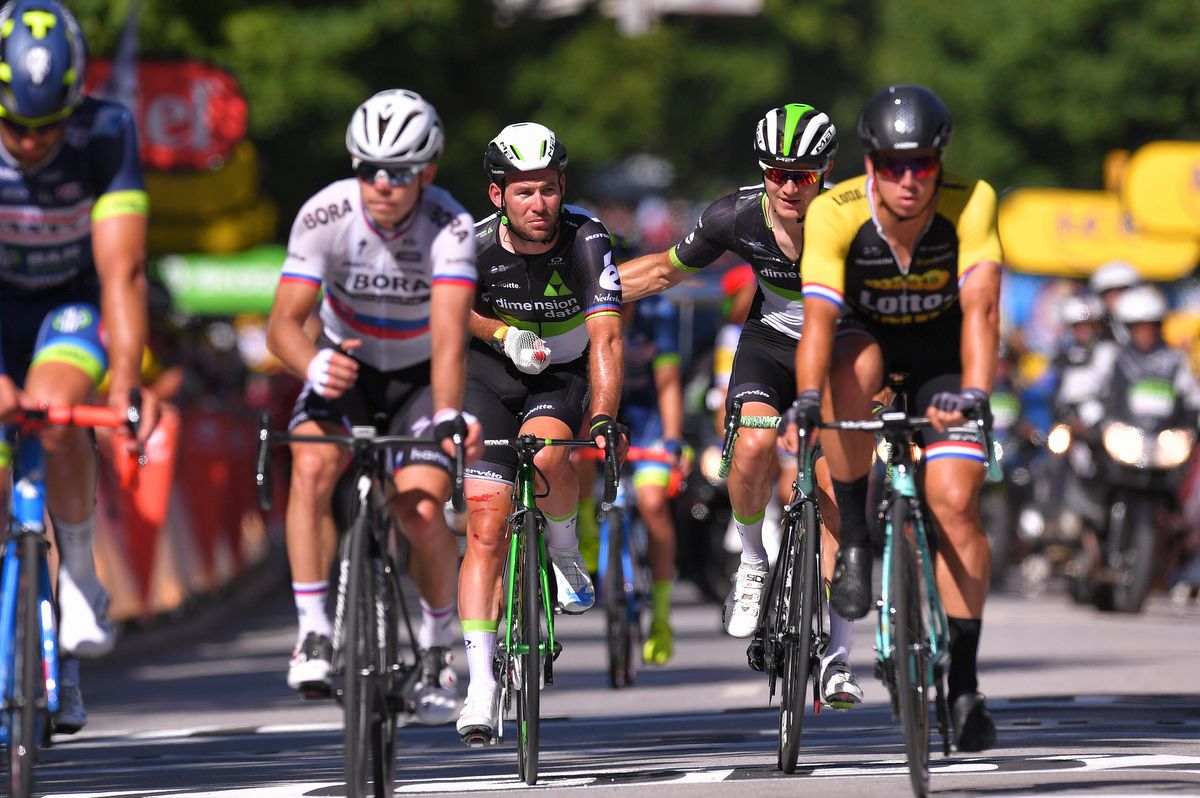 Mark Cavendish rolls over the line in Vittel after the crash that would end his Tour de France