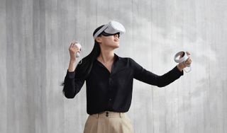 Best Oculus Quest 2 Accessories: A woman wearing the Oculus Quest 2 headset holding two controllers
