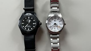 The Certina DS Action 43mm in Black next to the Christopher Ward C63 Sealander GMT, on a grey background