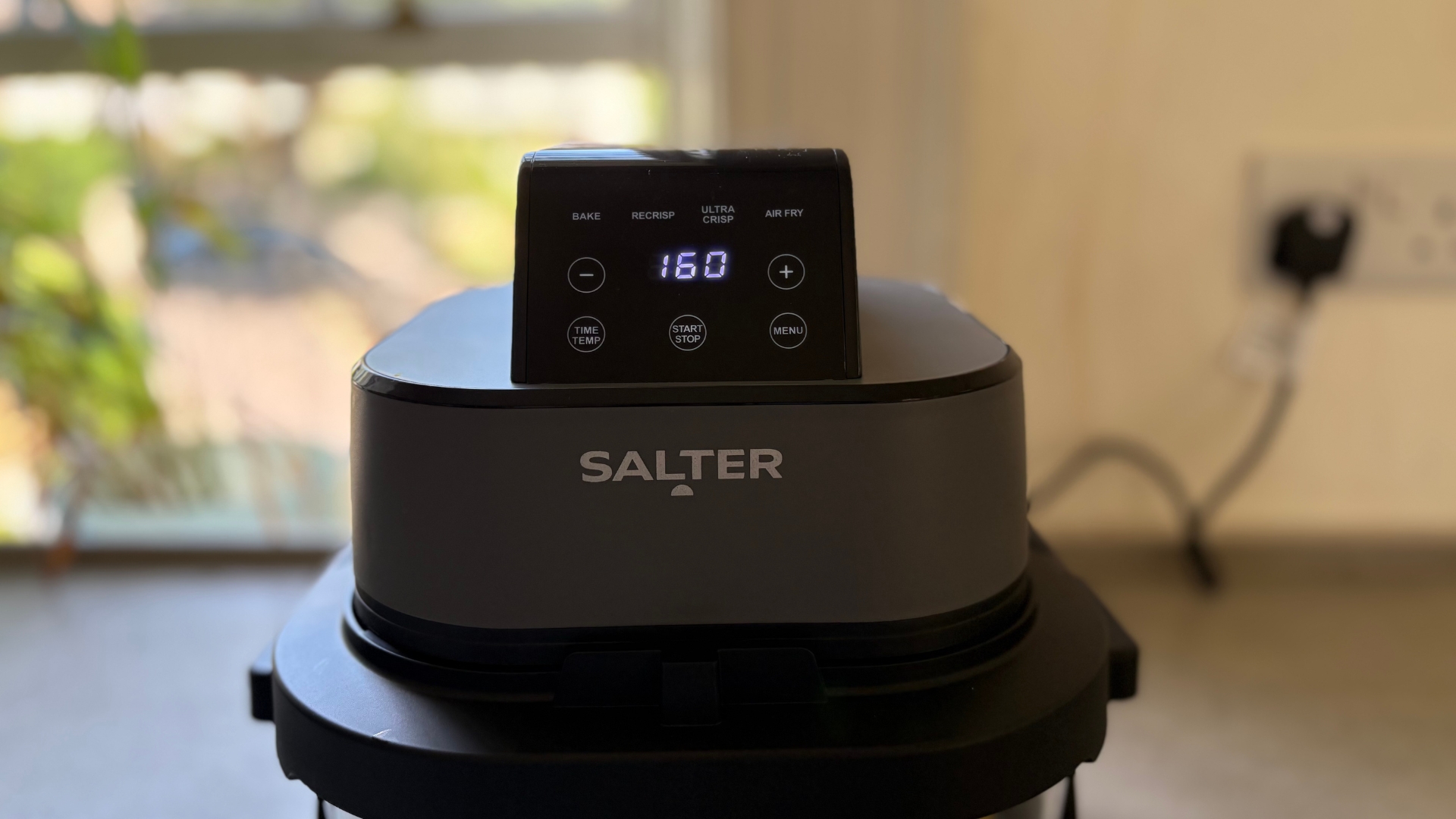 Testing the Salter Crisp &amp;amp; Go Portable Air Fryer, showing the temperature controls on the lid
