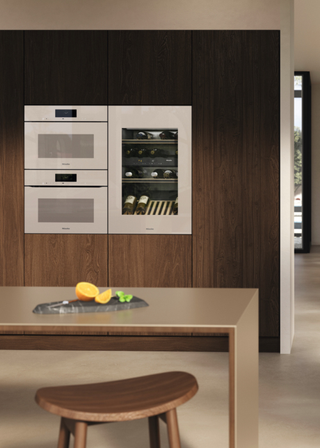 miele's new pearl beige cooking range in a modern, sleek kitchen design