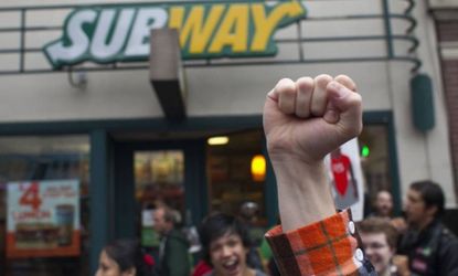Protesters gather outside a Seattle Subway restaurant during a strike aimed at the fast-food industry and the minimum wage on Thursday.