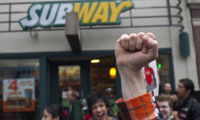 Protesters gather outside a Seattle Subway restaurant during a strike aimed at the fast-food industry and the minimum wage on Thursday.