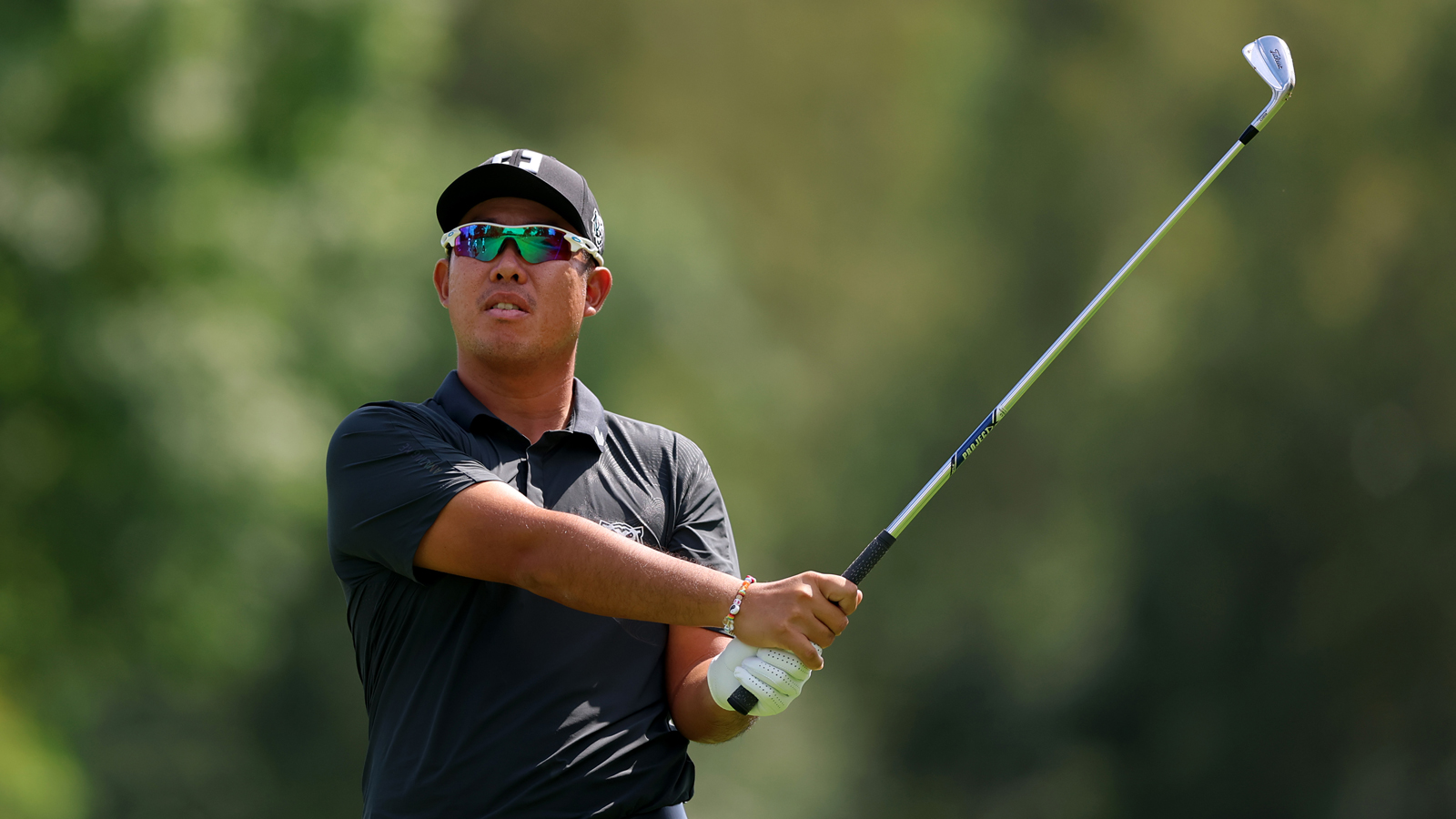 Byeong Hun An hits an approach shot