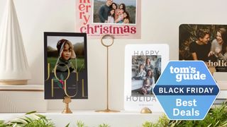 Christmas photos and cards shown on fireplace mantle