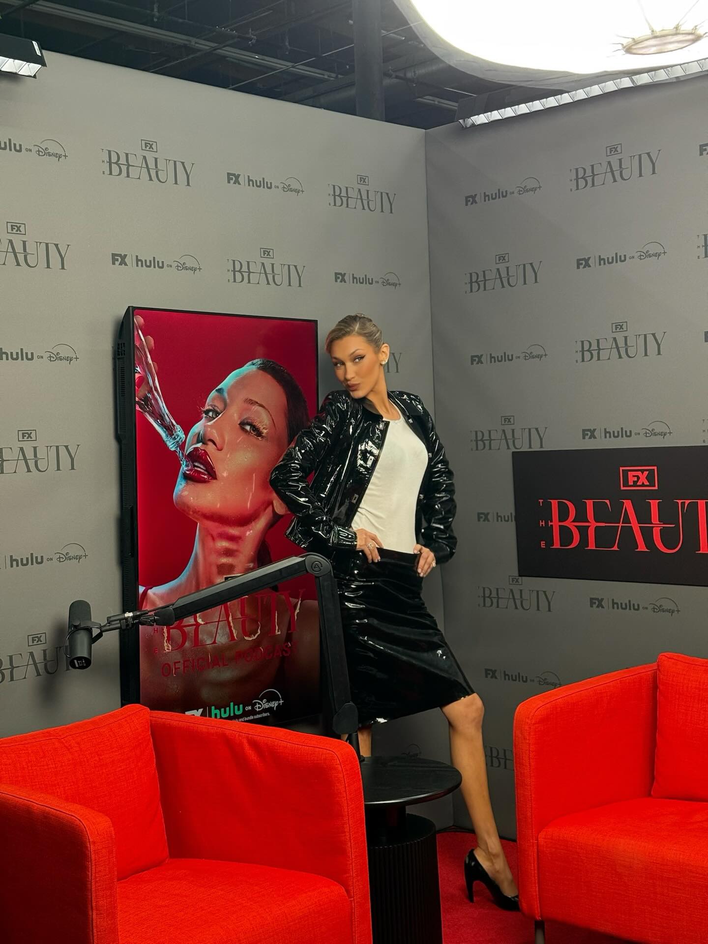 Bella Hadid wears a black leather pencil skirt