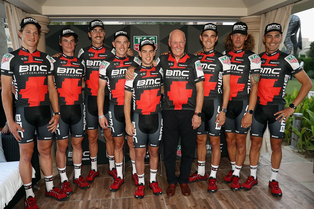 Jean-Claude Biver, TAG Heuer CEO poses with riders from the BMC Racing team during a press conference to announce Tag Heuer as a new sponsor of the BMC Cycling team