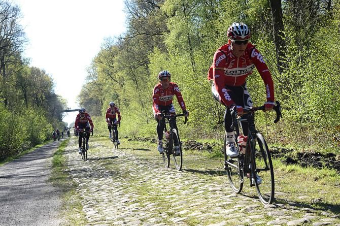Lotto Belisol riders pick their lines on the Arenberg forest cobbles