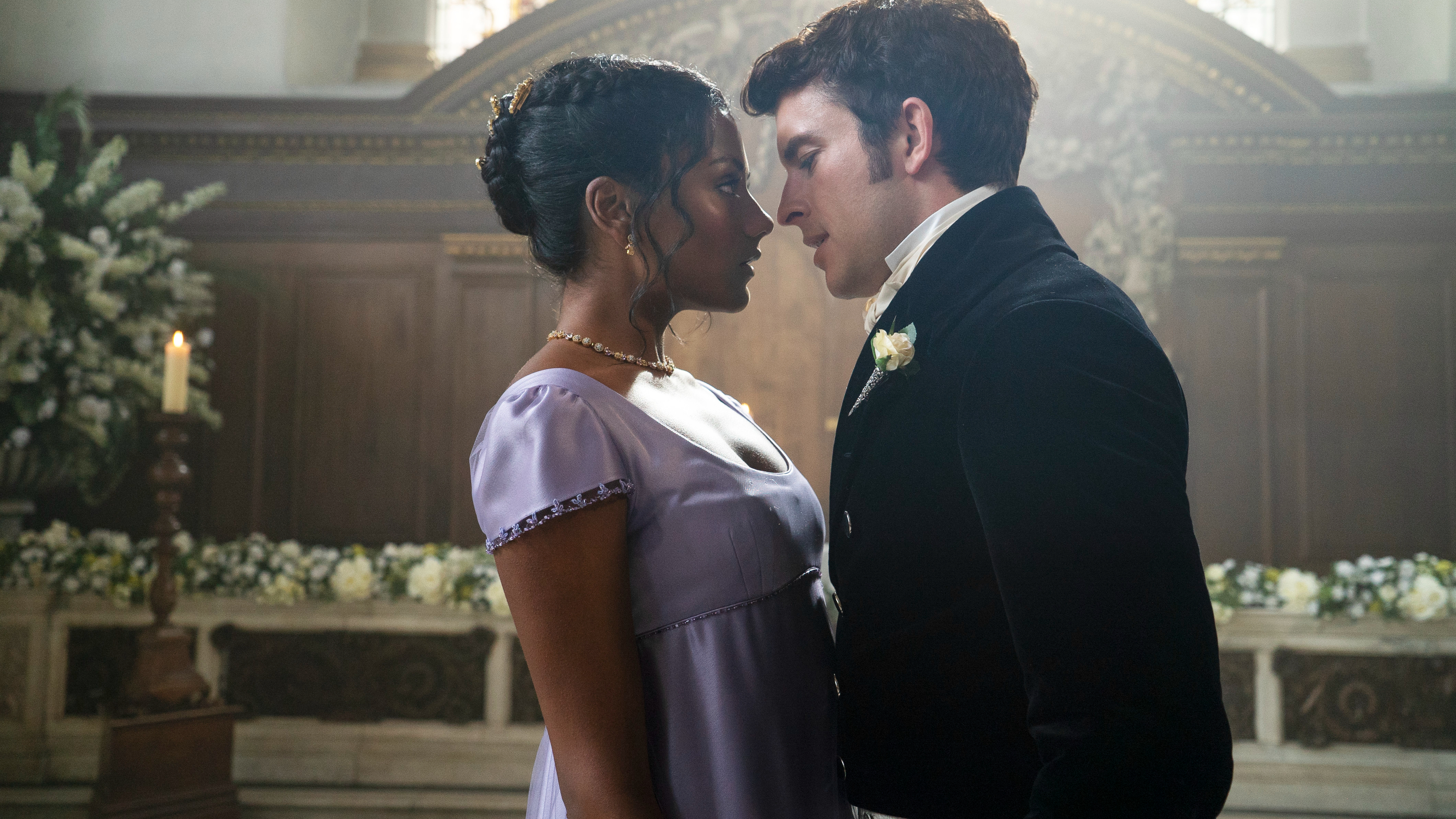simone ashley and jonathan bailey lean in for a kiss in bridgerton