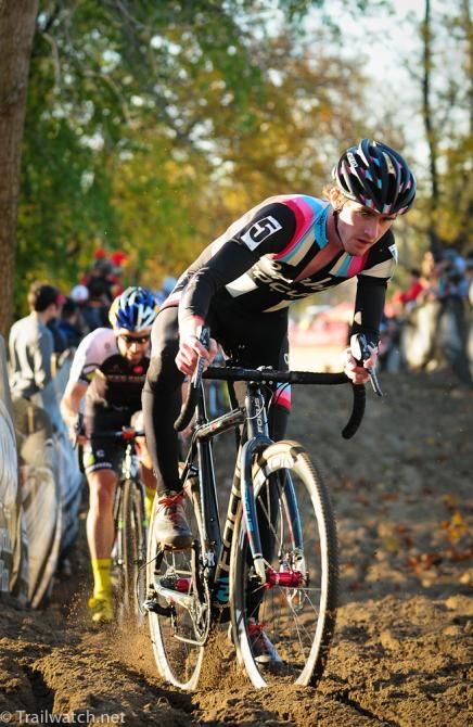 Zach McDonald (Rapha Focus) riding the sand ahead of Tim Johnson