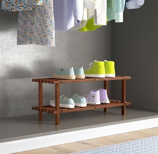Shoe rack with grey wall and wooden flooring