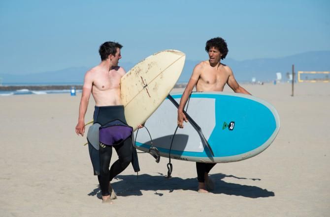 One of the advantages to a California training camp is surfing on your rest day, as Eric Young and Alex Candelario enjoy the time off.