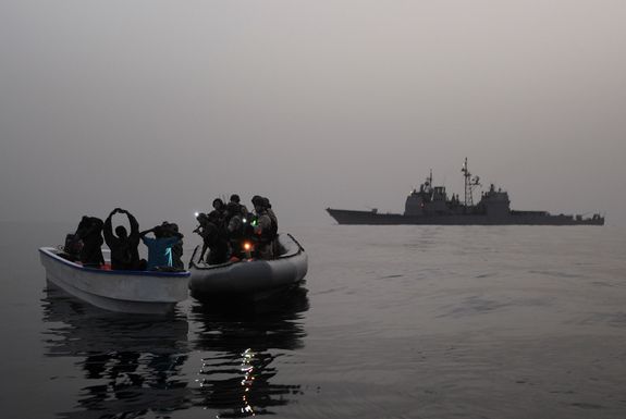 A visit, board, search and seizure team assigned to the guided-missile cruiser USS Anzio (CG 68) investigates a suspected pirate skiff in the Red Sea, Gulf of Aden, Somali Basin and Arabian Sea. Many pirate attacks are reported in the Gulf of Aden. 