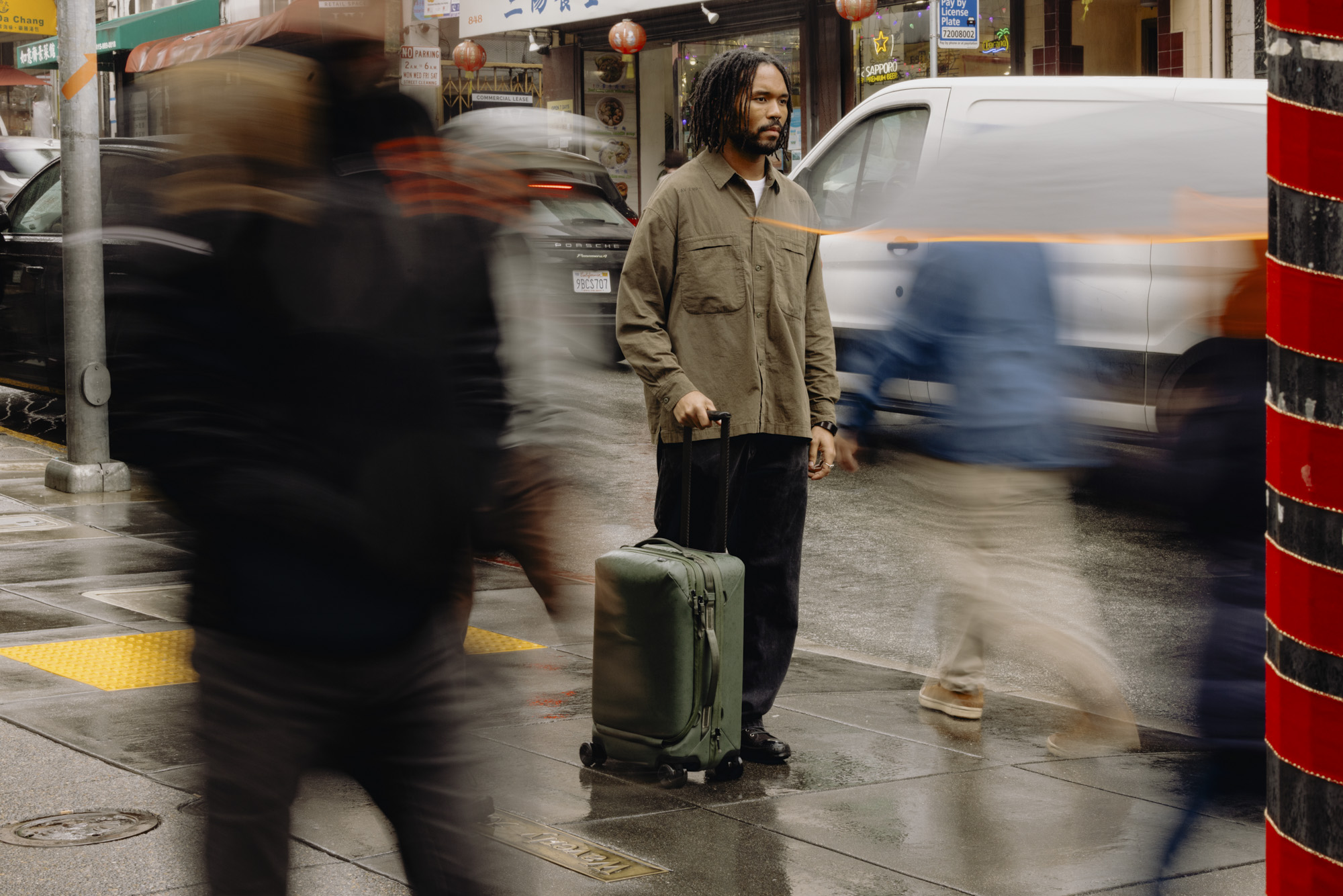 Peak Design Roller Pro roller being held by person on busy street