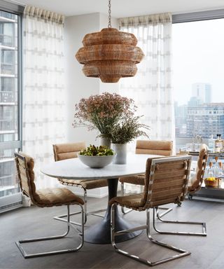 Brown chair cushions, white round table