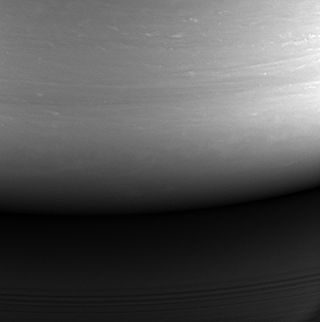 This monochrome photo — taken on Sept. 14, 2017, at a distance of about 394,000 miles (634,000 kilometers) from Saturn — is the last picture ever snapped by Cassini’s imaging cameras. It shows the spot where, a day later, the spacecraft plunged into Saturn’s atmosphere.