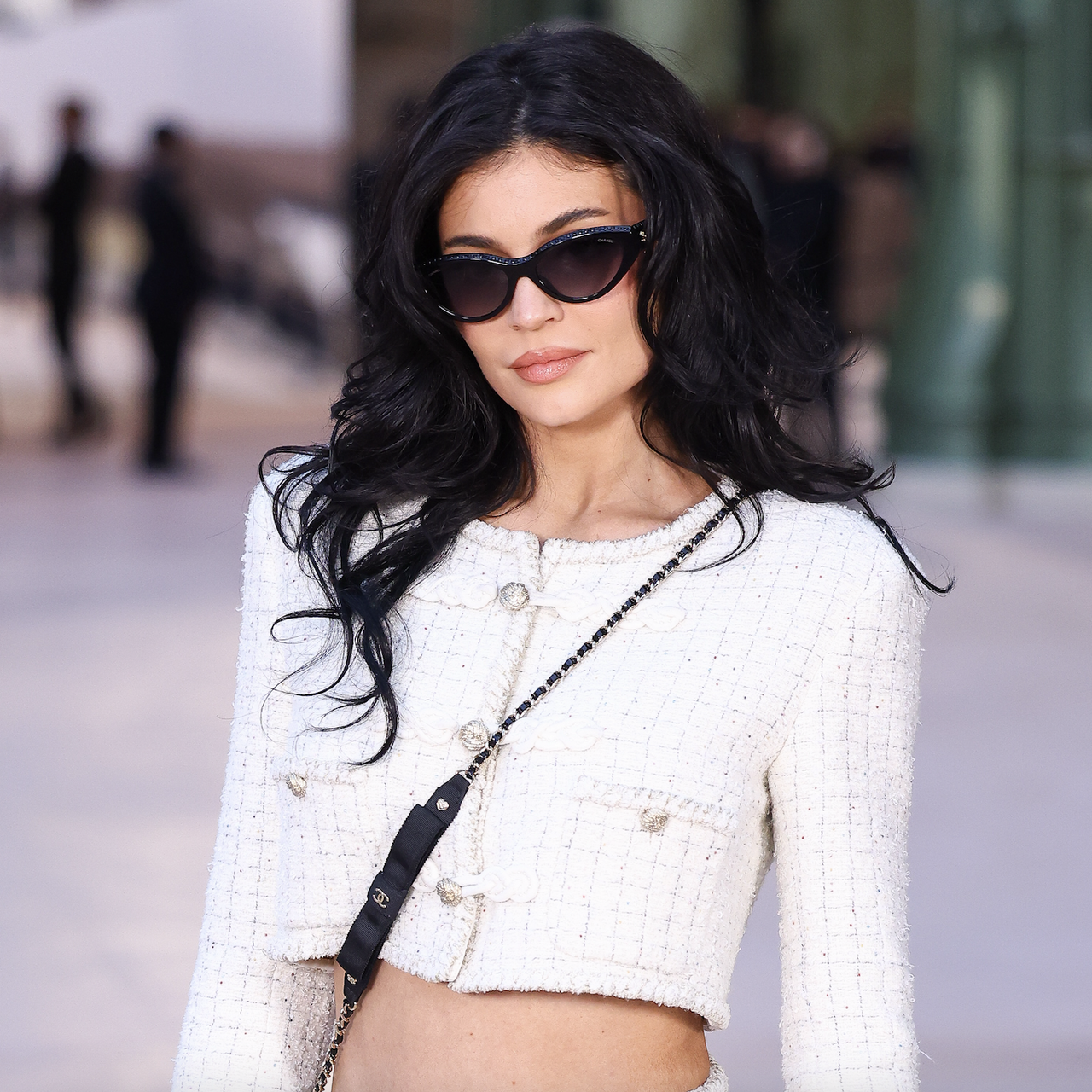 Kylie Jenner poses during a photocall ahead of the Chanel Women&#039;s Haute-Couture Spring/Summer 2025 collection as part of the Fashion Week in Paris, on January 28, 2025 wearing a white tweed crop top and skirt set with a chanel crossbody