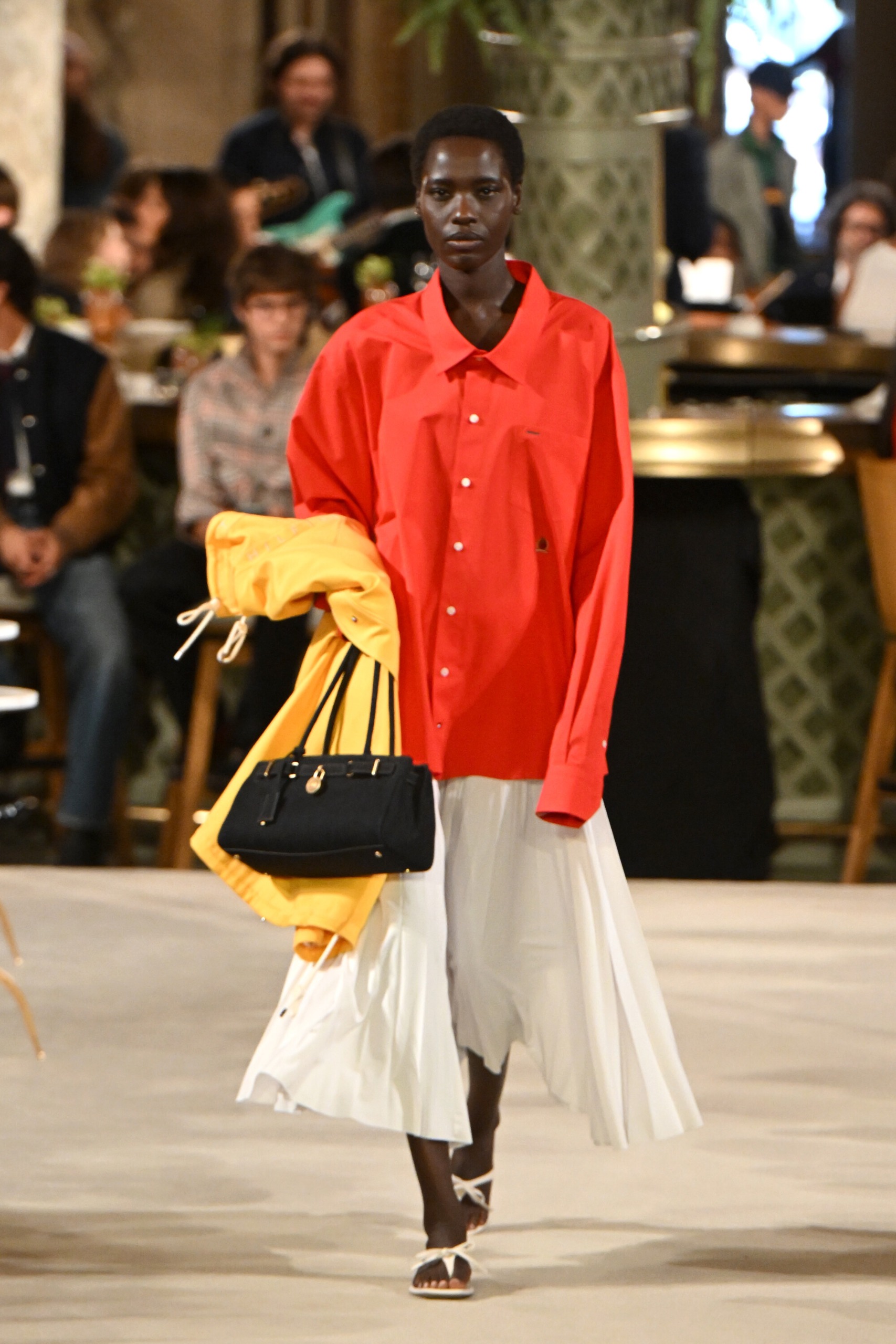 Tommy Hilfiger ss27 runway model wears white skirt red shirt
